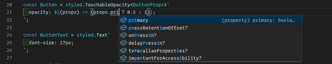 Screenshot of a code editor displaying a JavaScript snippet using styled-components. There is a 'const Button' declaration for a styled TouchableOpacity with a ternary operation inside a template literal to determine its opacity. The operation reads: 'opacity: ${(props) => (props.pri... ? 0.5 : 1)};'. The autocomplete dropdown menu is suggesting 'primary' as a property, alongside other properties like 'pressRetentionOffset', 'onPressIn', and 'delayPressIn'. Below is a 'const ButtonText' declaration for a styled Text component with a 'font-size' of '17px'.